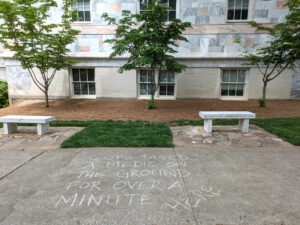 Image of graffiti near Emory Quadrangle saying, cops tased a medic on the ground for over a minute here.